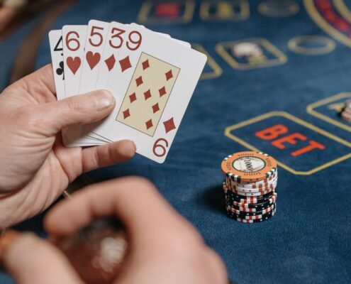 Close Up Of A Card Hand Playing Baccarat
