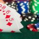 Close Up Of A 5 Card Stud Poker Hand With Poker Chips