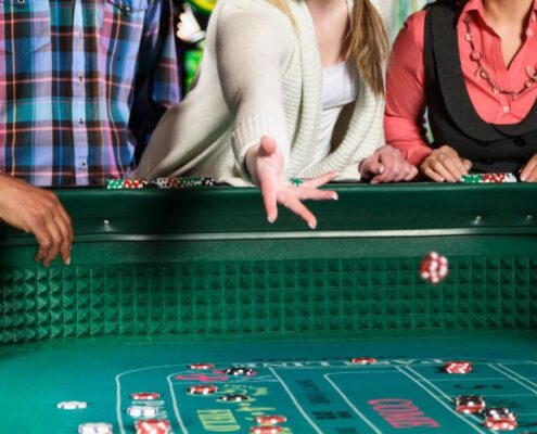 Close Up Of People Playing Craps