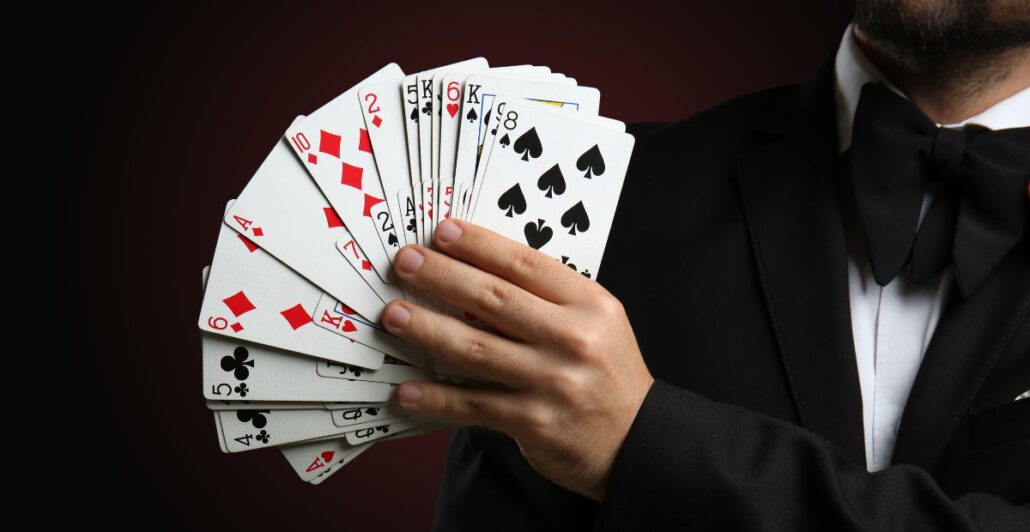 Magician Holding A Fan Of Cards For A Card Trick